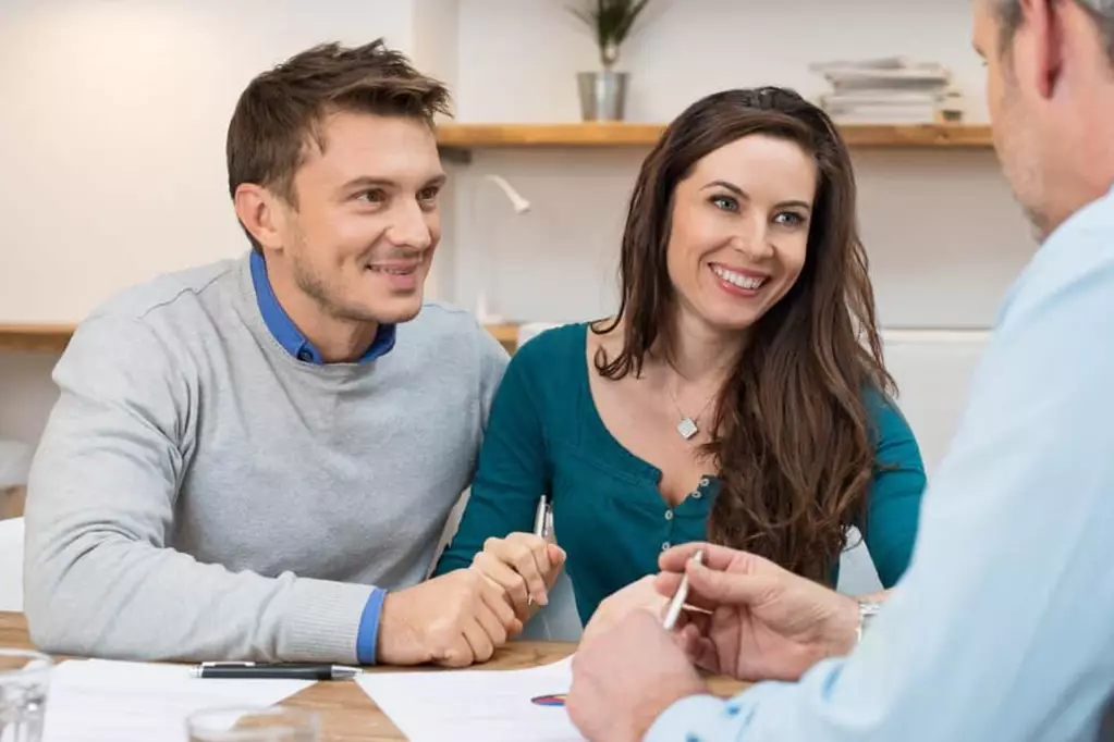 Young couple meeting with a lender